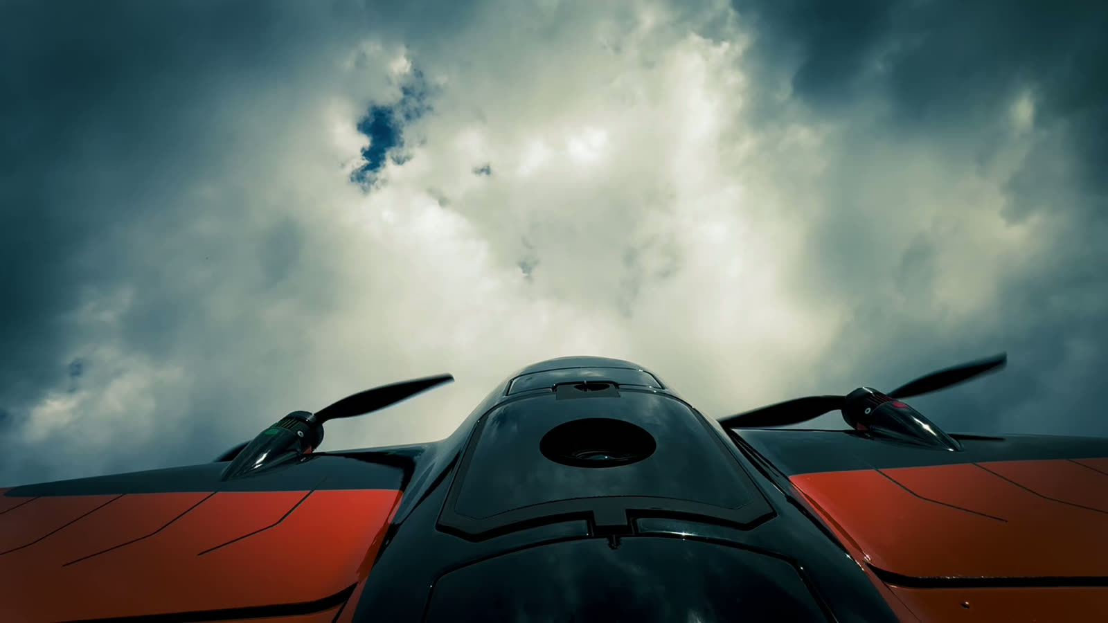 Drone silhouetted against a dramatic sky