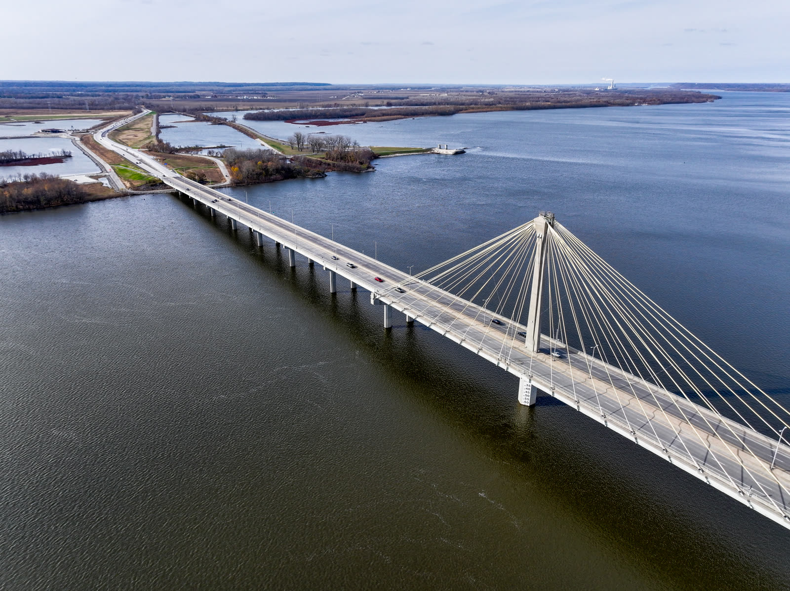 Aerial view of a cable-stayed bridge over water